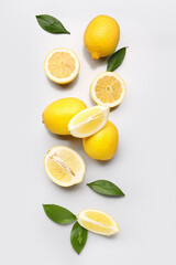 Composition with fresh lemons on grey background