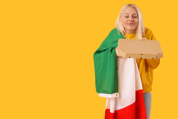 Mature woman with flag of Italy and pizza on yellow background