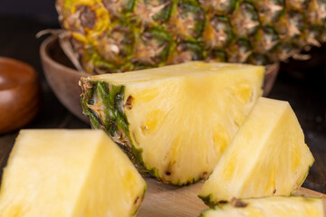 sliced ripe yellow pineapple, a large number of pieces
