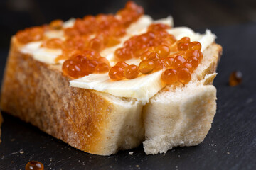 red salmon caviar with white bread and butter