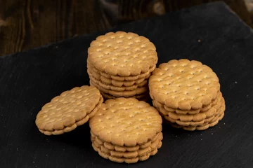 Fotobehang crispy cookies with chocolate filling between cookies © rsooll
