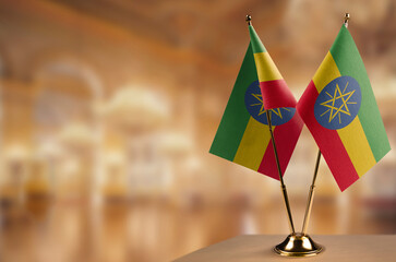 Small flags of the Ethiopia on an abstract blurry background