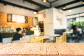 Empty wooden table in front of abstract blurred background of coffee shop . can be used for display Mock up  of product