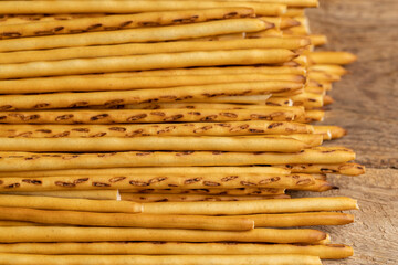 Thin and long bread sticks made of wheat flour on the table