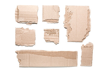 Pieces of cardboard on white background