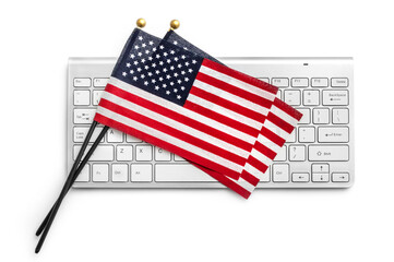 American flags with computer keyboard on white background.