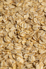 Poured a large amount of oat flakes close-up