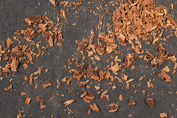 a crumbled piece of bitter chocolate into small pieces