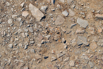 Soil background. Stony ground. Ground and stones. Crushed stones