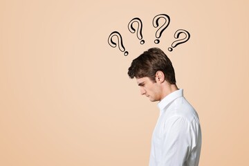 A thoughtful young man with a question mark