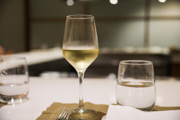 refinement and indulgence, a fancy wine glass in a restaurant represents a celebration of taste, culture, and socializing. It evokes feelings of luxury, pleasure, and conviviality