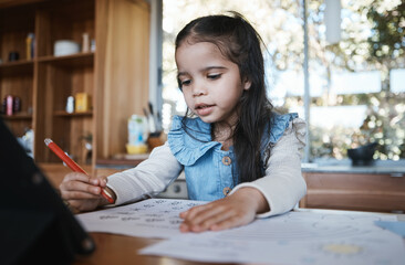 Learning, education and girl writing in at a kitchen table for homework, drawing and home school activity. Education, student and kid with paper for sketch, art and lesson for child development