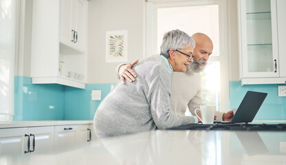 Elderly couple, laptop and video call in kitchen, web browsing or social media in house. Computer, retirement and happy man and woman on videocall, online chat and virtual communication together.