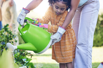 Children, watering plants and a mother teaching her daughter about growth or sustainability in the...