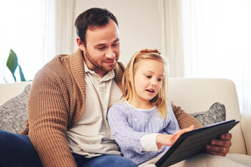 Family, father and a child with a tablet for learning at home while playing a game for education on internet. A man or dad and girl kid on sofa for streaming, mobile app and website for development