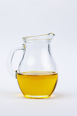 Glass jug with olive oil.
