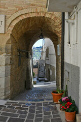A narrow street among the old houses of Biccari, a historic town in the state of Puglia in Italy.