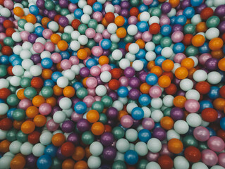 Fototapeta na wymiar Colorful Balls in Kids Toy Playground, Colorful Plastic Toy Balls, Children's Entertainment Center, Color Nylon Rope Webs Textures