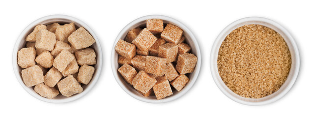 Ceramic bowl plates of natural brown refined sugar and sugar cubes on white background.