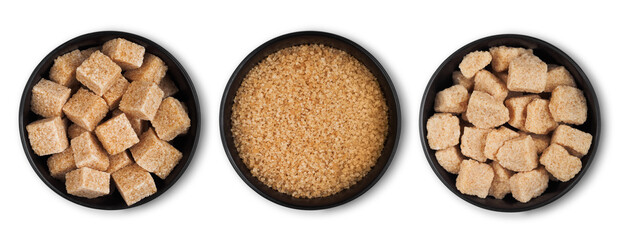 Black bowl plates of natural brown refined sugar and sugar cubes on white background.