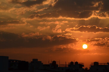 Fototapeta premium beautiful city sunset, cityscape, god rays