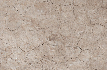 Cracked ground background in the top view for graphic design or wallpaper