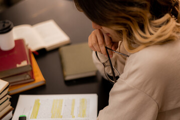 Holding glasses while reading