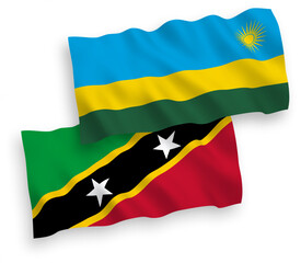 Flags of Federation of Saint Christopher and Nevis and Republic of Rwanda on a white background