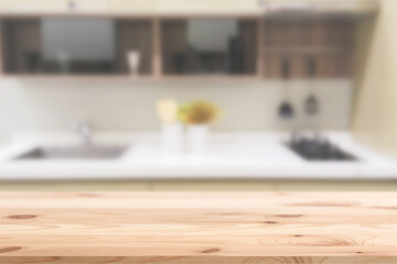 Blur sink counter space in modern home kitchen with wooden foreground for advertising montage background