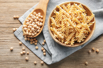 Chickpea bean fusilli pasta on a old wooden background.
