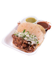 Delicious meat tacos in takeaway container isolated on white