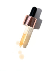 Cosmetic pipette with drops of cosmetic oil
