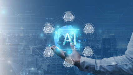 Artificial intelligence (AI) and machine learning concept. Businessman hand holding artificial intelligence (AI) icon over modern cityscape background.