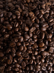 Roasted coffee beans closeup texture background