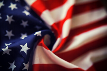 Naklejka premium American striped flag and a stack of one hundred dollar bills. Financial center of the world.