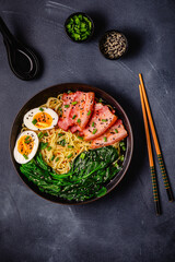 Traditional ramen noodle soup with brisket, spinach and egg.