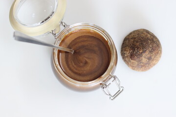 Homemade palm jaggery syrup. Liquid palm jaggery made by heating block of solid palm jaggery. Healthy sweetener for coffee and deserts