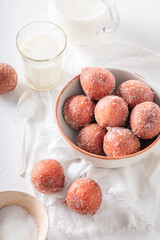 Hot mini doughnuts for Fat Thursday in Poland.