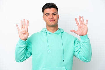 Young caucasian handsome man isolated on white background counting nine with fingers