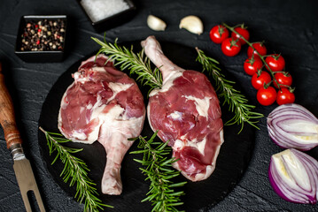 raw duck legs on stone background