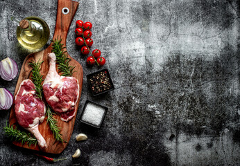 raw duck legs on stone background with copy space for your text