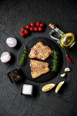 grilled pangasius white fish fillet with spices on a stone background 