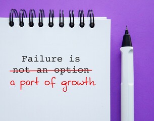 Notebook with text FAILURE IS NOT AN OPTION, corrected to FAILURE IS A PART OF GROWTH, to avoid...