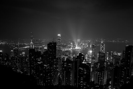 Fototapeta black and white city skyline at night in hong kong island