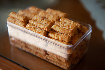 kaasstengels cakes in a box made of plastic , Kaastengel or kue keju commonly found in the Netherlands.