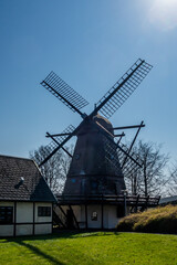 Fototapeta na wymiar Copenhagen, Denmark A small histroic windmill in the Brondby suburb.