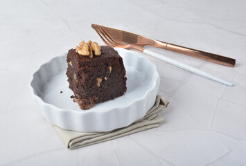premium freshly baked dark cocoa chocolate brownie square cake with walnut in wood bento box on white marble halal food sweet dessert menu for pastry cafe shop