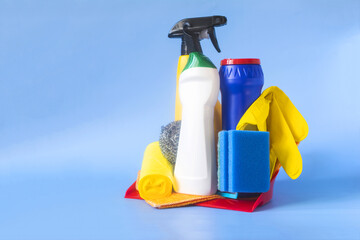 A set of tools for maintaining cleanliness in close-up on a blue background copy space