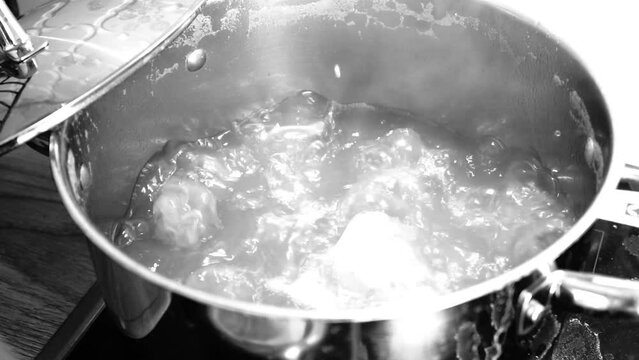 Boiling water inside a metal pot