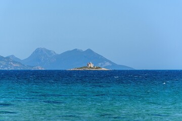 Lighthouse on a small island near Korcula island in Adriatic sea in Croatia on sunny day